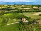 Preview: Rustic dream home in Italy – 3,000 m² surrounded by greenery with panoramic views, aerial view of farmhouse and countryside.