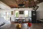 Preview: Rustic dream home in Italy – 3,000 m² surrounded by greenery with panoramic views, dining room with wooden table, fruit bowl and rustic ceiling.