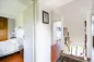 Preview: Rustic dream home in Italy – 3,000 m² surrounded by greenery with panoramic views, upstairs hallway with access to bedrooms.