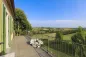 Preview: Rustic dream home in Italy – 3,000 m² surrounded by greenery with panoramic views, balcony overlooking rolling hills.