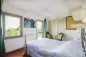 Preview: Rustic dream home in Italy – 3,000 m² surrounded by greenery with panoramic views, bedroom with balcony access and vintage chairs.