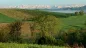 Preview: Rustic dream home in Italy – 3,000 m² surrounded by greenery with panoramic views, snowy Alps and green fields in the foreground.